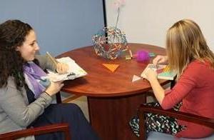 Child participating in game therapy with CAYAC therapist